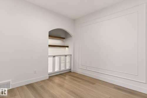 Empty room with light wood-type flooring and baseboards - 9 Elwyck Gate, Spruce Grove, AB - Indoor Photo Showing Other Room