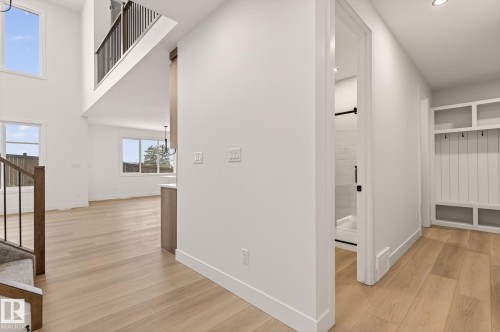 Hall featuring light wood-style flooring and a high ceiling - 9 Elwyck Gate, Spruce Grove, AB - Indoor Photo Showing Other Room