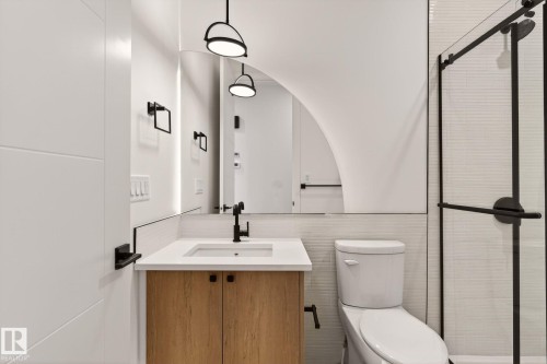 Bathroom featuring vanity, a shower stall, and tile walls - 9 Elwyck Gate, Spruce Grove, AB - Indoor Photo Showing Bathroom