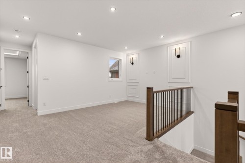 Hallway with light carpet, recessed lighting, and an upstairs landing - 9 Elwyck Gate, Spruce Grove, AB - Indoor Photo Showing Other Room