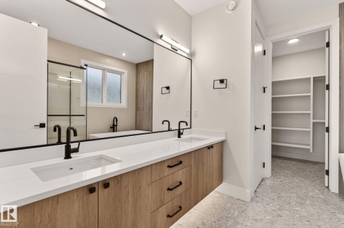 Full bathroom with a shower stall, double vanity, a walk in closet, and recessed lighting - 9 Elwyck Gate, Spruce Grove, AB - Indoor