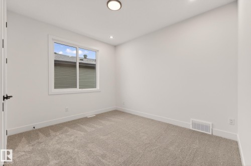 Empty room with light carpet and recessed lighting - 9 Elwyck Gate, Spruce Grove, AB - Indoor Photo Showing Other Room