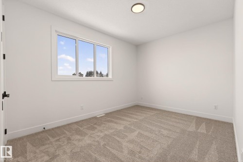 Unfurnished room featuring light carpet - 9 Elwyck Gate, Spruce Grove, AB - Indoor Photo Showing Other Room