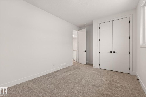 Unfurnished bedroom featuring carpet floors and a closet - 9 Elwyck Gate, Spruce Grove, AB - Indoor Photo Showing Other Room
