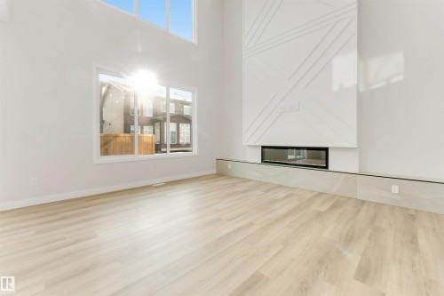 5807 Kootook Link Link, Edmonton, AB - Indoor Photo Showing Other Room With Fireplace