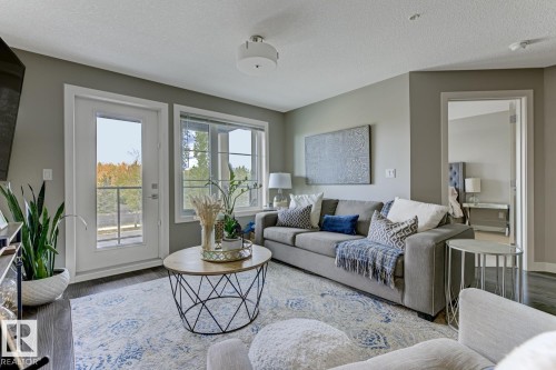 210 5029 Edgemont Boulevard, Edmonton, AB - Indoor Photo Showing Living Room