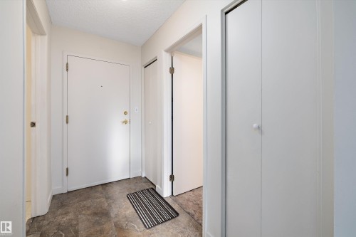 Doorway to outside with a textured ceiling - 218 18012 95 Avenue, Edmonton, AB - Indoor Photo Showing Other Room