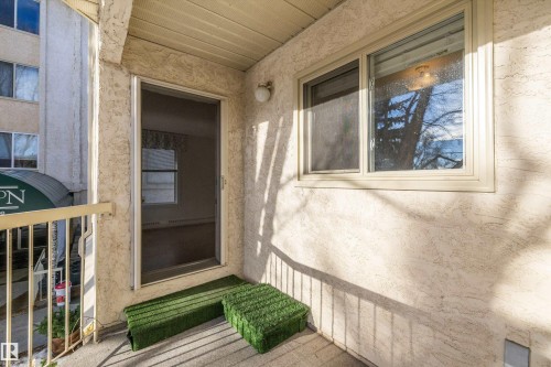 Doorway to property with stucco siding - 218 18012 95 Avenue, Edmonton, AB - Outdoor With Exterior
