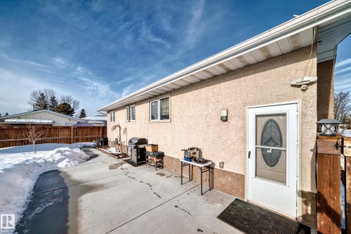 Property entrance featuring a patio area and stucco siding - 12203 147 Avenue, Edmonton, AB - Outdoor With Exterior