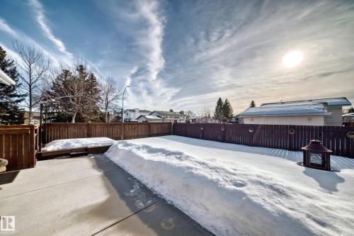 Yard layered in snow with a fenced backyard - 12203 147 Avenue, Edmonton, AB - Outdoor