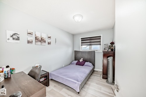 Bedroom featuring wood finished floors - 12203 147 Avenue, Edmonton, AB - Indoor Photo Showing Bedroom