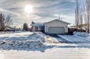 View of front facade featuring an attached garage, concrete driveway, and stucco siding - 12203 147 Avenue, Edmonton, AB  - Outdoor 