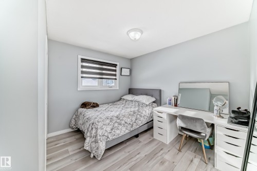 Bedroom featuring light wood-style floors and a desk - 12203 147 Avenue, Edmonton, AB - Indoor Photo Showing Bedroom