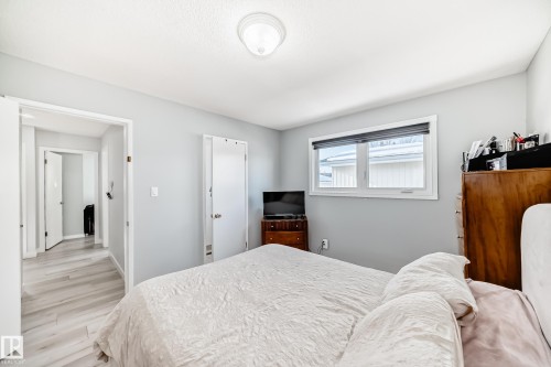 Bedroom featuring light wood-type flooring and baseboards - 12203 147 Avenue, Edmonton, AB - Indoor Photo Showing Bedroom