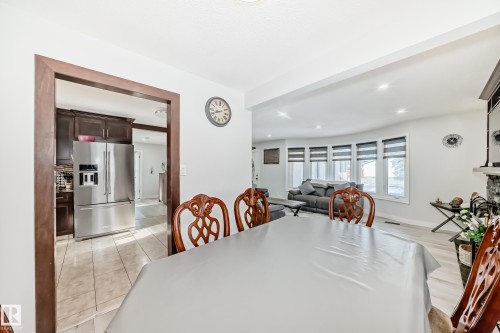 Dining room featuring light tile patterned floors and recessed lighting - 12203 147 Avenue, Edmonton, AB - Indoor Photo Showing Dining Room