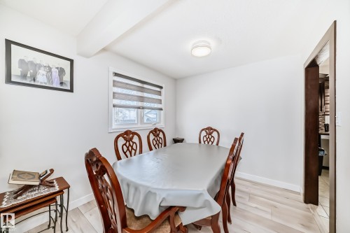 Dining space featuring light wood-style floors and beamed ceiling - 12203 147 Avenue, Edmonton, AB - Indoor Photo Showing Dining Room