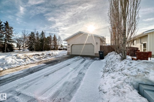 Exterior space featuring a garage and stucco siding - 12203 147 Avenue, Edmonton, AB - Outdoor