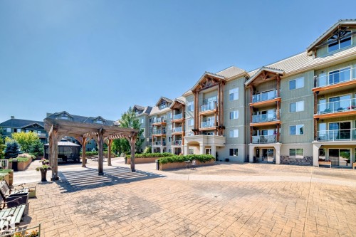 View of community with a pergola and a patio - 125 278 Suder Greens Drive, Edmonton, AB - Outdoor With Facade