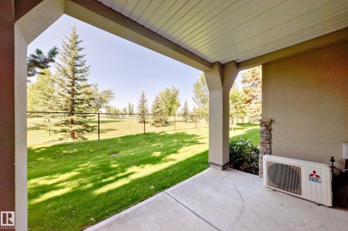 Fenced backyard with a patio - 125 278 Suder Greens Drive, Edmonton, AB - Outdoor