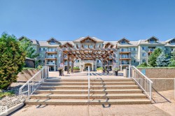 Back of property with stairway and a pergola - 