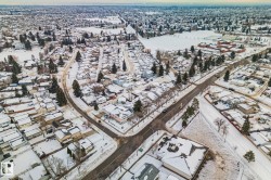 Snowy aerial view featuring a residential view - 
