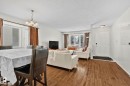 Dining space with hardwood / wood-style flooring, a chandelier, and a textured ceiling - 17523 95 Street, Edmonton, AB  - Indoor Photo Showing Other Room 