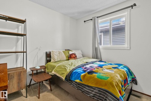 Bedroom with carpet floors and a textured ceiling - 17523 95 Street, Edmonton, AB - Indoor Photo Showing Bedroom