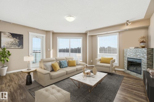 320 7801 Golf Course Road, Stony Plain, AB - Indoor Photo Showing Living Room With Fireplace