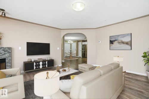 320 7801 Golf Course Road, Stony Plain, AB - Indoor Photo Showing Living Room With Fireplace