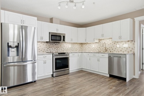320 7801 Golf Course Road, Stony Plain, AB - Indoor Photo Showing Kitchen With Upgraded Kitchen