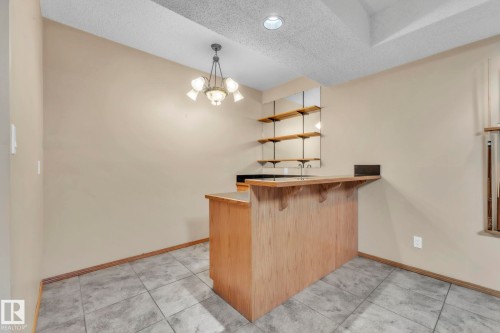Wet bar with loads of cabinetry - 1217 Summerside Drive, Edmonton, AB - Indoor Photo Showing Other Room
