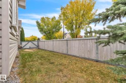 Fenced backyard featuring a gate - 