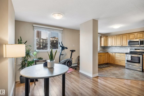 Office space featuring light wood-type flooring - 402 9929 113 Street, Edmonton, AB - Indoor Photo Showing Kitchen