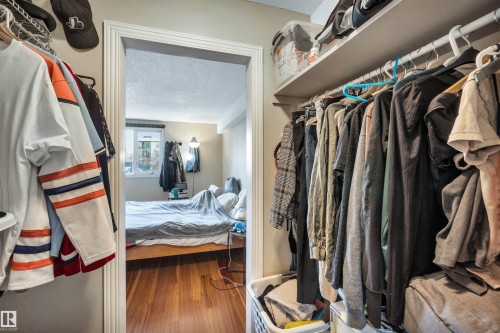 Spacious closet featuring wood finished floors - 402 9929 113 Street, Edmonton, AB - Indoor With Storage
