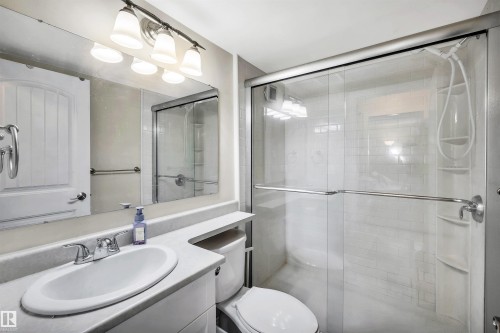 Bathroom featuring vanity and a shower stall - 402 9929 113 Street, Edmonton, AB - Indoor Photo Showing Bathroom