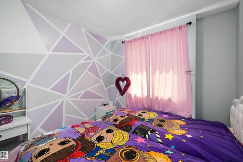 Bedroom with a textured ceiling - 127 Cornell Court, Edmonton, AB - Indoor Photo Showing Bedroom