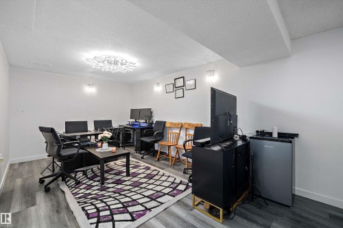 Home office with a textured ceiling and wood finished floors - 127 Cornell Court, Edmonton, AB - Indoor