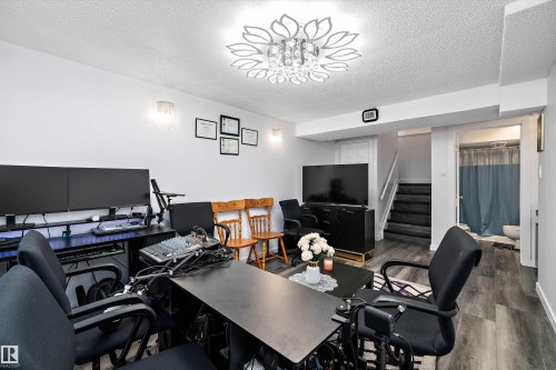 Office area featuring a textured ceiling and dark wood-type flooring - 127 Cornell Court, Edmonton, AB - Indoor Photo Showing Office