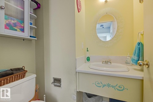 Half bath featuring vanity and toilet - 18307 66 Avenue, Edmonton, AB - Indoor Photo Showing Bathroom