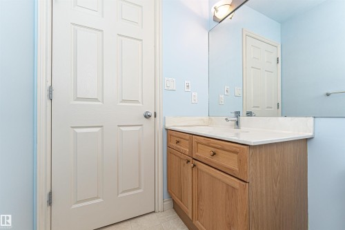 Bathroom featuring vanity and light tile patterned flooring - 112 260 Sturgeon Road, St. Albert, AB - Indoor Photo Showing Bathroom
