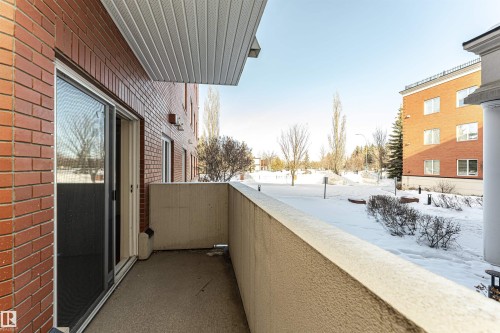 View of snow covered back of property - 112 260 Sturgeon Road, St. Albert, AB - Outdoor With Exterior
