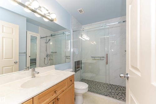 Full bathroom featuring vanity and a marble finish shower - 112 260 Sturgeon Road, St. Albert, AB - Indoor Photo Showing Bathroom