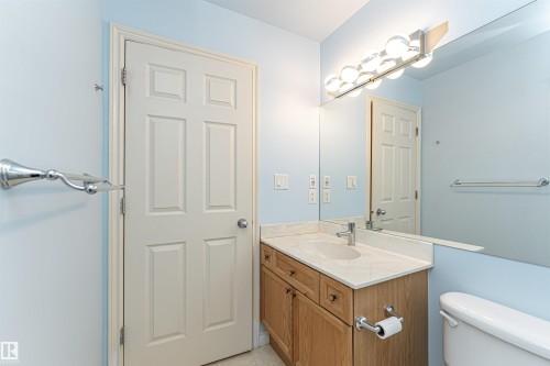 Half bath featuring vanity and light tile patterned floors - 112 260 Sturgeon Road, St. Albert, AB - Indoor Photo Showing Bathroom