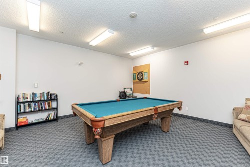 Recreation room featuring pool table and a textured ceiling - 112 260 Sturgeon Road, St. Albert, AB - Indoor Photo Showing Other Room