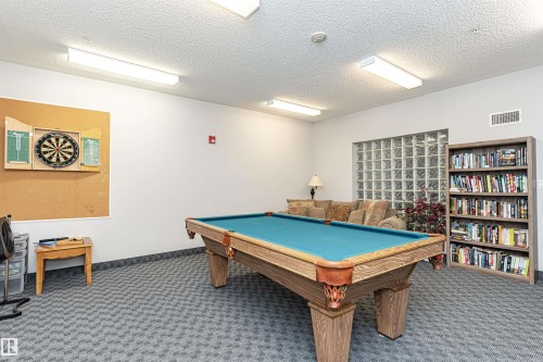 Recreation room featuring billiards and a textured ceiling - 112 260 Sturgeon Road, St. Albert, AB - Indoor Photo Showing Other Room