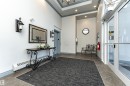 Foyer entrance with a baseboard radiator, ornamental molding, a high ceiling, recessed lighting, and elevator - 112 260 Sturgeon Road, St. Albert, AB  - Indoor Photo Showing Other Room 
