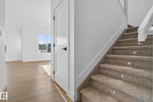 Stairway featuring wood finished floors and recessed lighting - 3508 6 Street, Edmonton, AB - Indoor Photo Showing Other Room