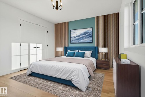 Bedroom featuring an accent wall, light wood finished floors, a closet, and a chandelier - 3508 6 Street, Edmonton, AB - Indoor Photo Showing Bedroom