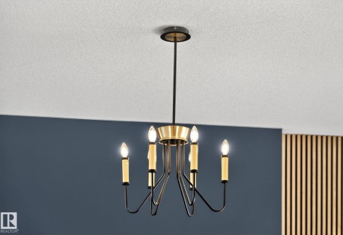 Detailed view of suspended lighting and a textured ceiling - 3508 6 Street, Edmonton, AB - 