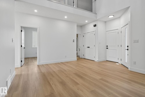 Foyer entrance featuring light wood-type flooring, recessed lighting, and a high ceiling - 3508 6 Street, Edmonton, AB - Indoor Photo Showing Other Room